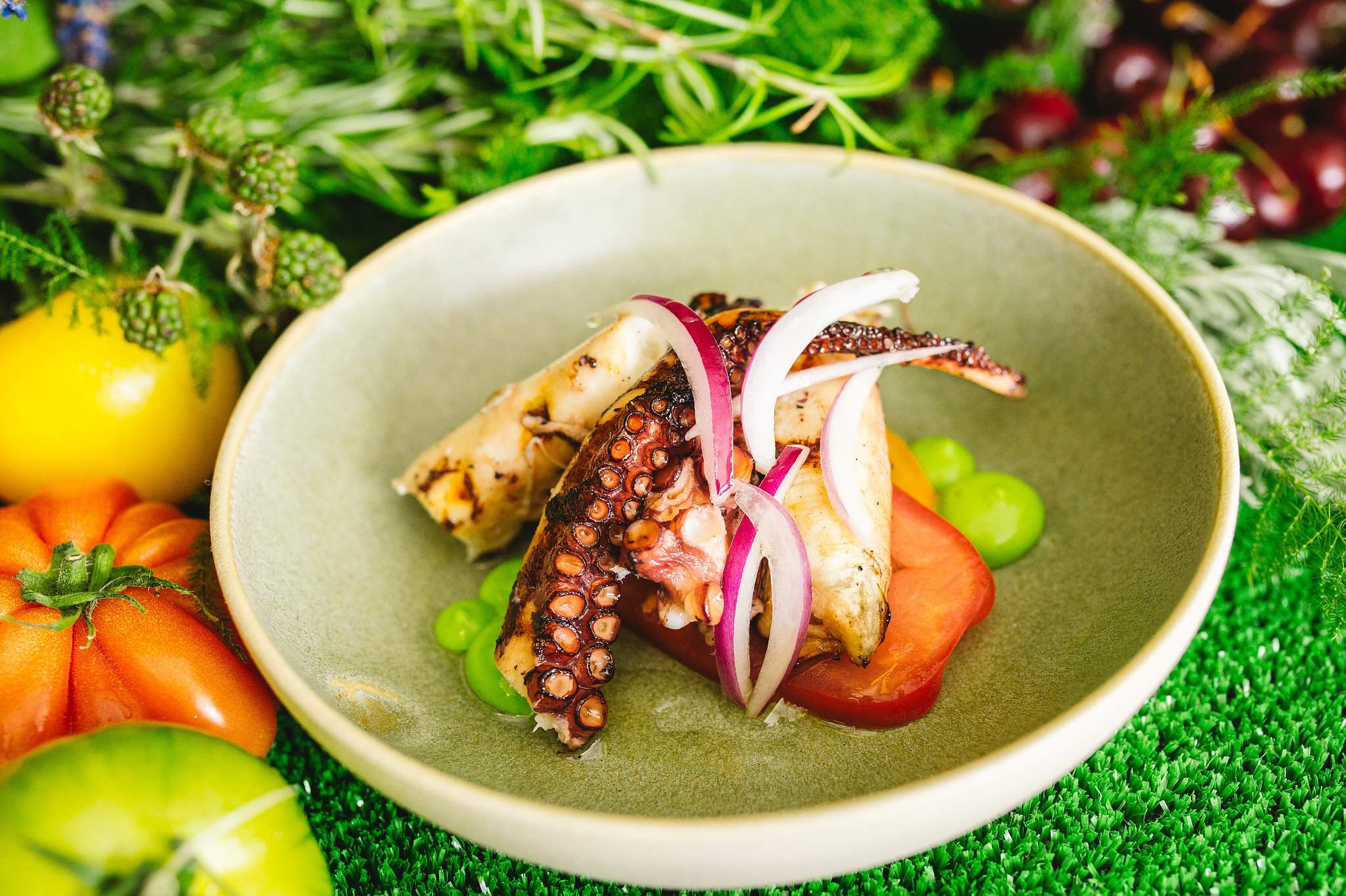 A meal of octopus and veggies