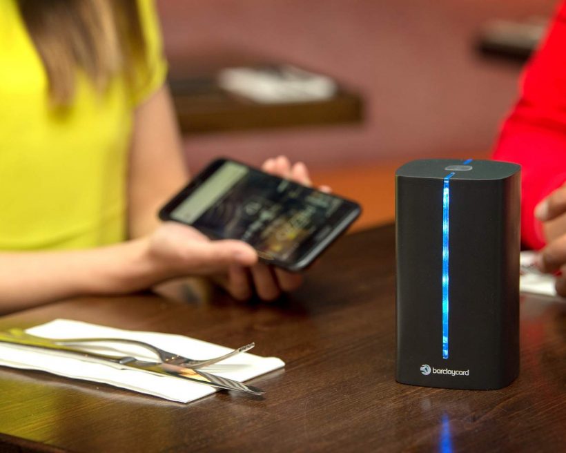 restaurant customers using tech at table