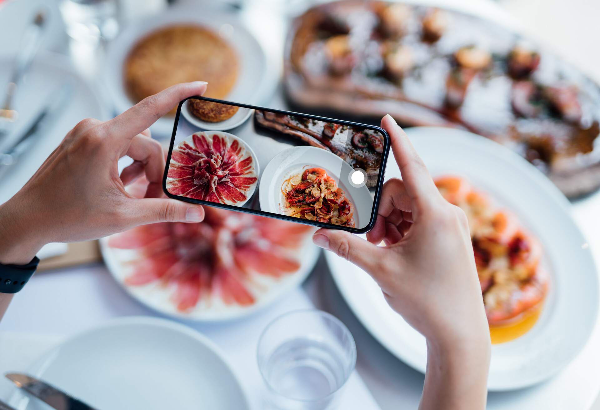photo of person taking photo of their food
